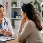 Early warning signs of cancer, a person talking with a doctor about symptoms