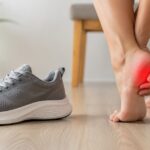 shoes for plantar fasciitis, a supportive cushioned sneaker beside a person rubbing a sore heel